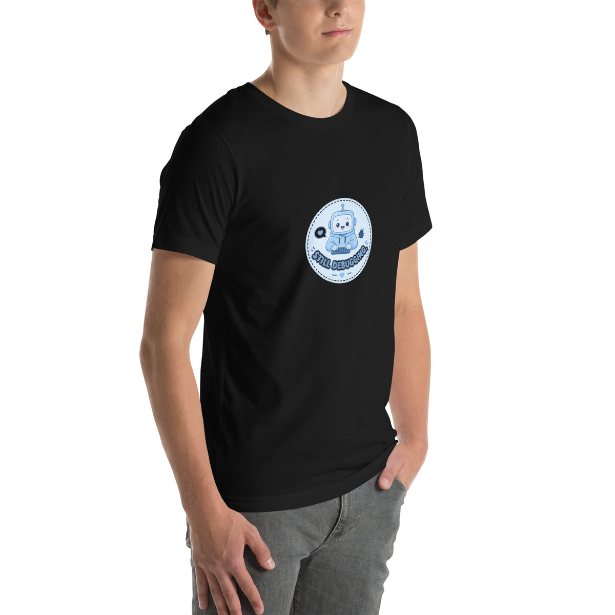 Debug Badge tee STILL DEBUGGING — cute coding robot graphic tee mockup
